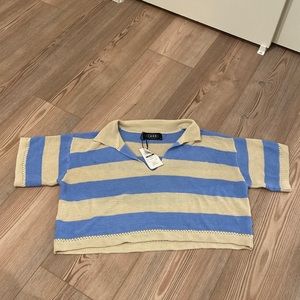 Cropped light weight collared shirt. Never worn.